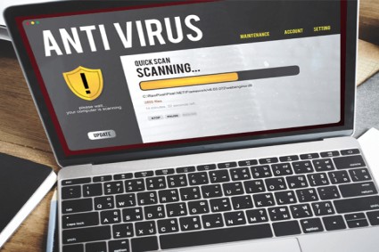 Antivirus program scanning a laptop for malware and viruses